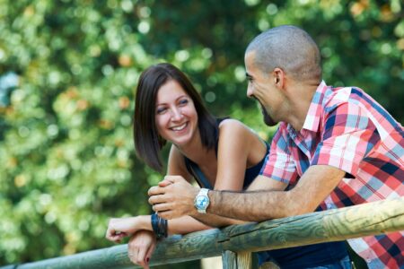 Couple talking, outside, park