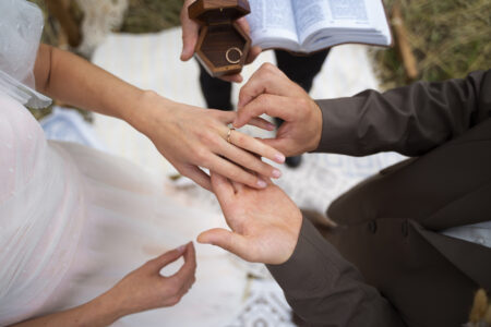 Engagement ring on an open Bible, symbolizing a Christ-centered marriage decision.
