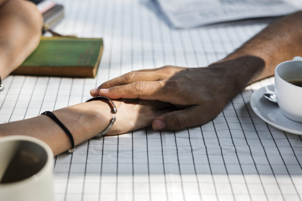 Small, brave moment of connection between spouses starting to rebuild emotional intimacy