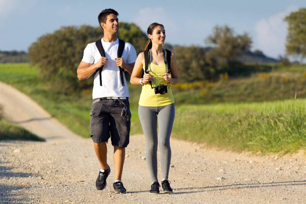 Couple hiking up a trail together, symbolizing shared goals and long-term alignment in marriage.
