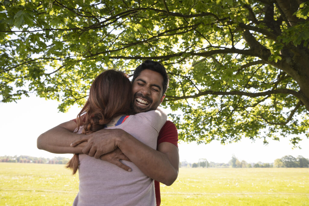 Couple having an honest but kind conversation, sitting closely and calm