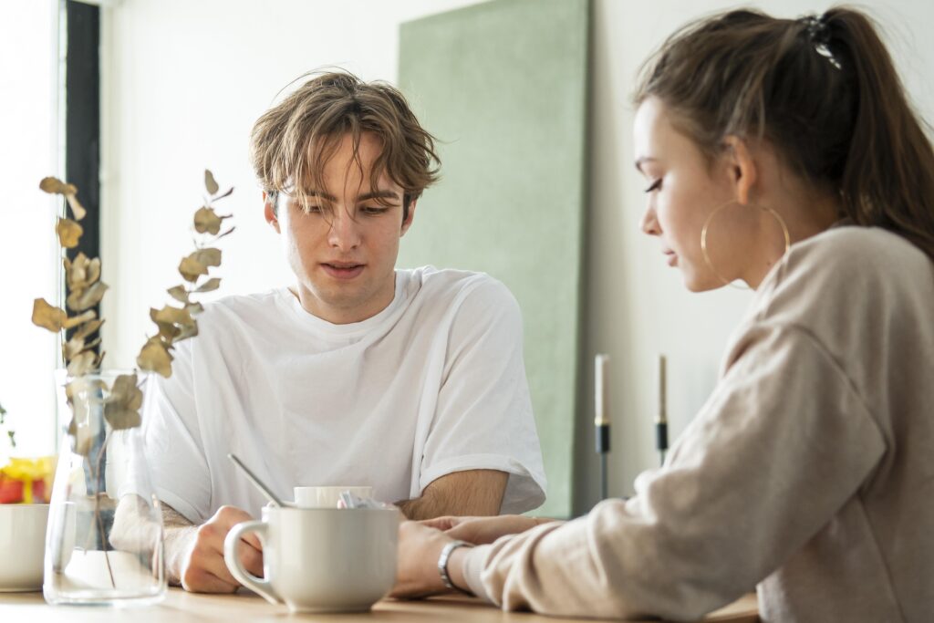 Married couple having a serious talk, choosing to stay connected despite challenges