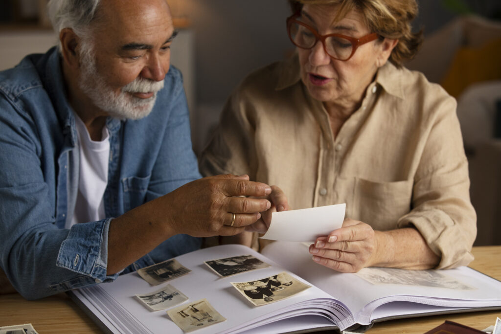 Married couple reminiscing over their wedding photos, reflecting on the journey and their decision to stay