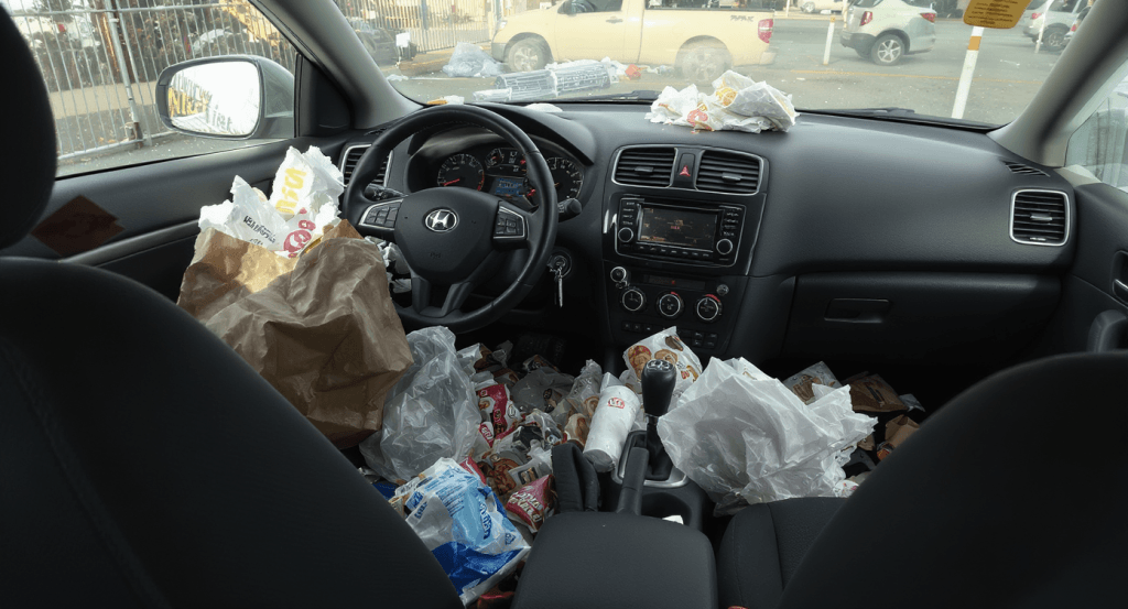Cluttered car filled with junk, symbolizing unresolved emotional baggage in marriage