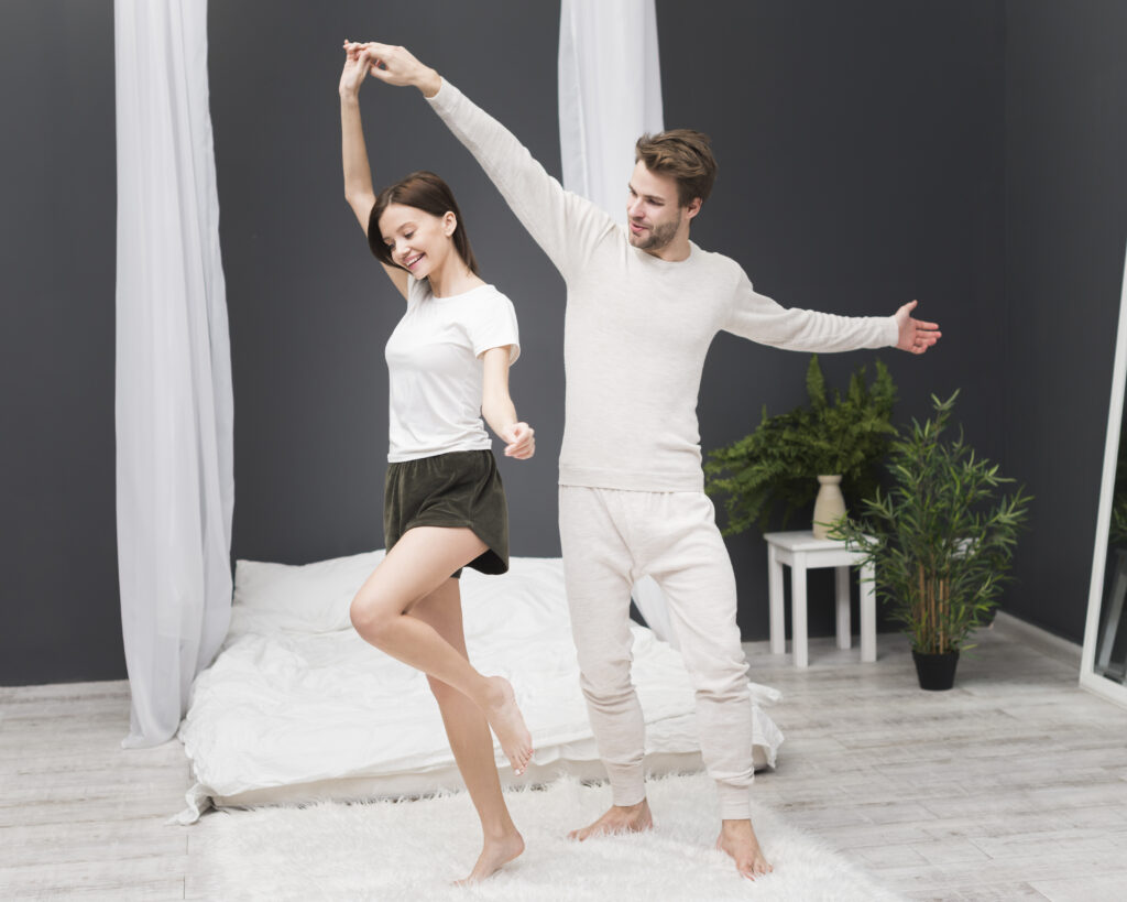 Married couple dancing at home during a spontaneous date night