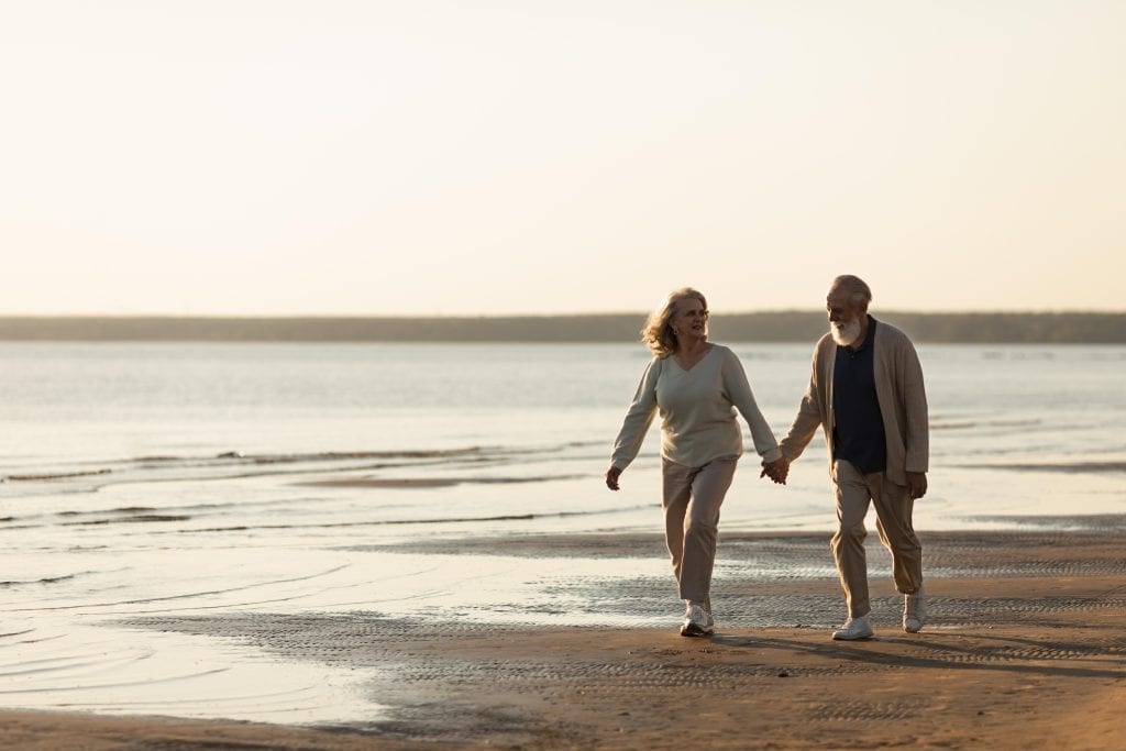 Married couple walking with intentional connection, symbolizing daily relational discipline