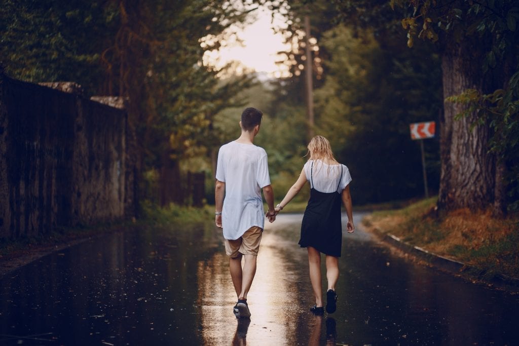 Married couple walking forward with purpose, led by shared values and confident choices