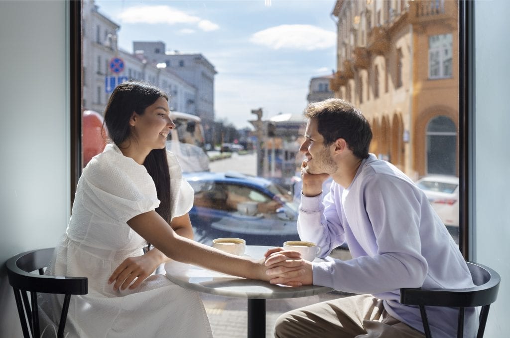 Married couple having a warm, honest conversation over coffee