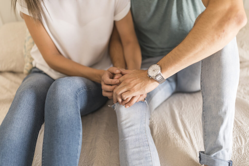 Spouses praying side by side, showing spiritual connection and commitment