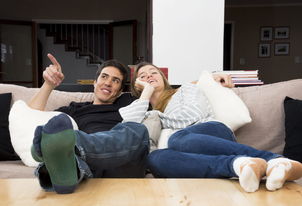 Spouses enjoying a simple, joyful evening together at home