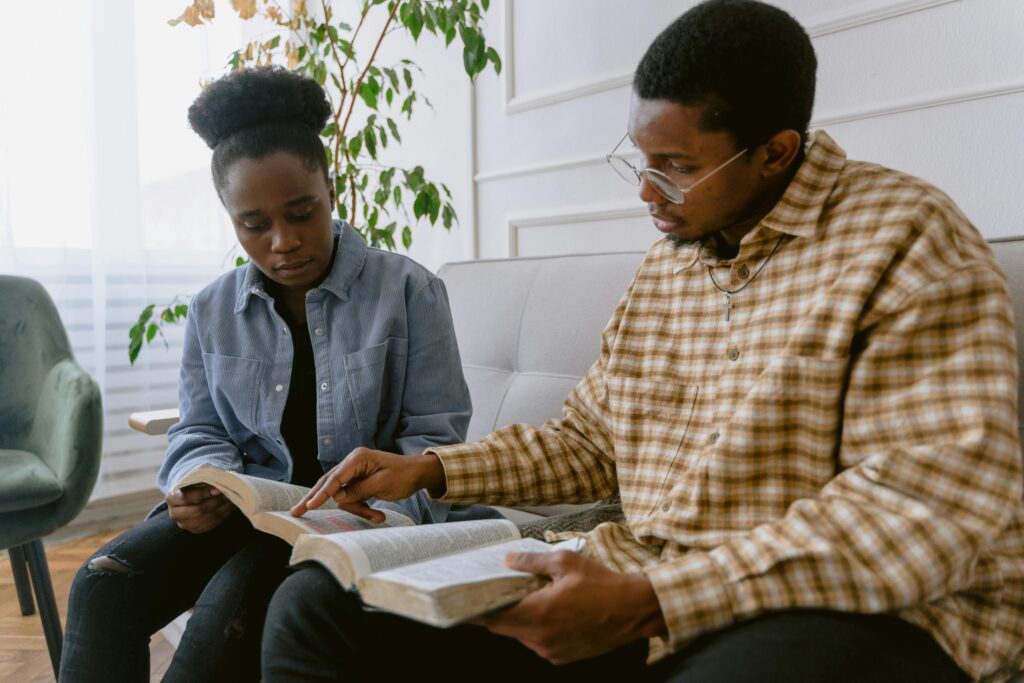 Married couple building spiritual intimacy through shared prayer and study.