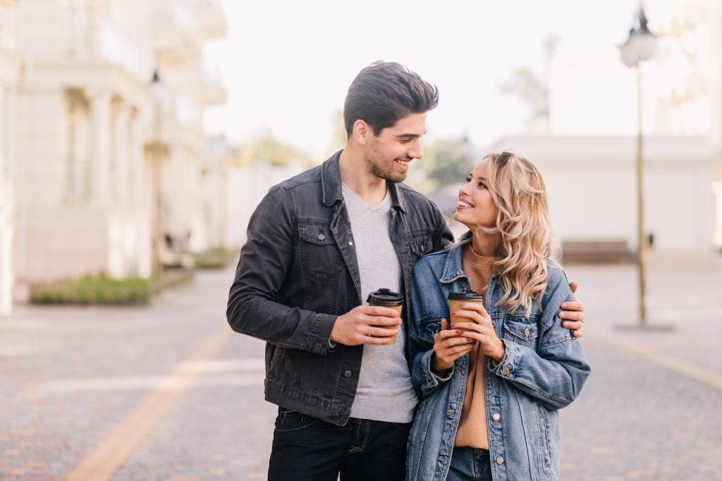 Husband and wife enjoying a relaxed, playful walk as best friends