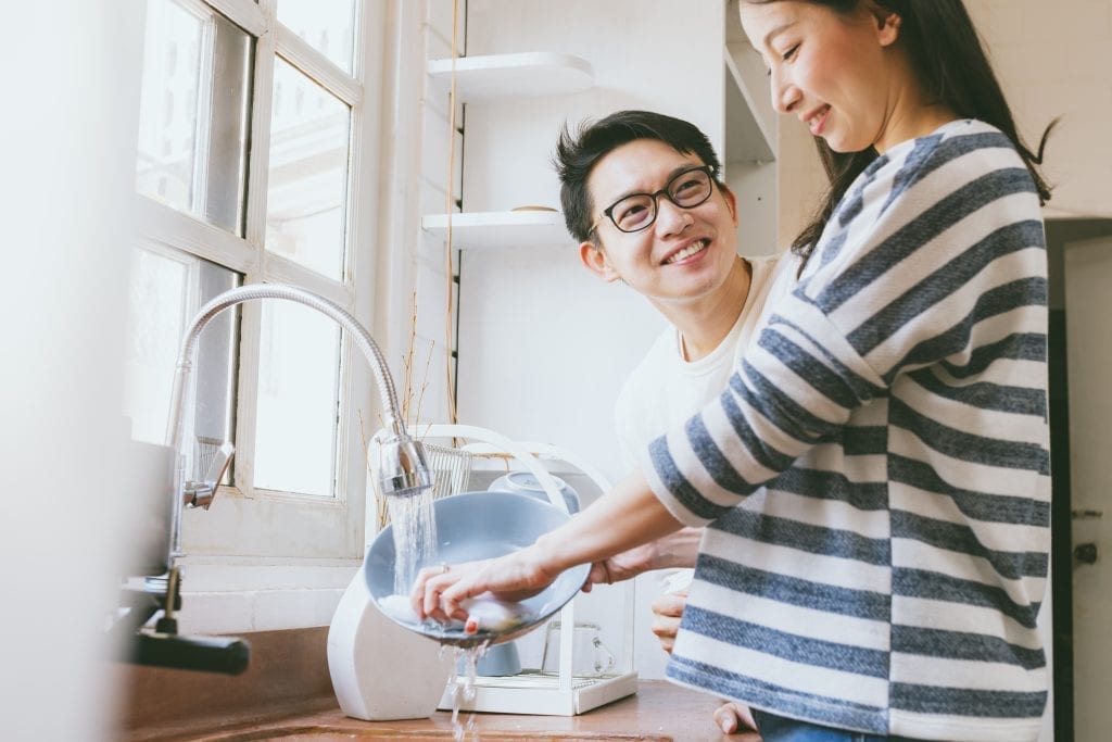 Couple building high-leverage habits during daily routines to strengthen their marriage.