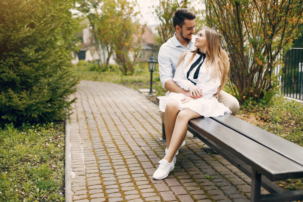 Married couple quietly holding hands, symbolizing small steady acts of love