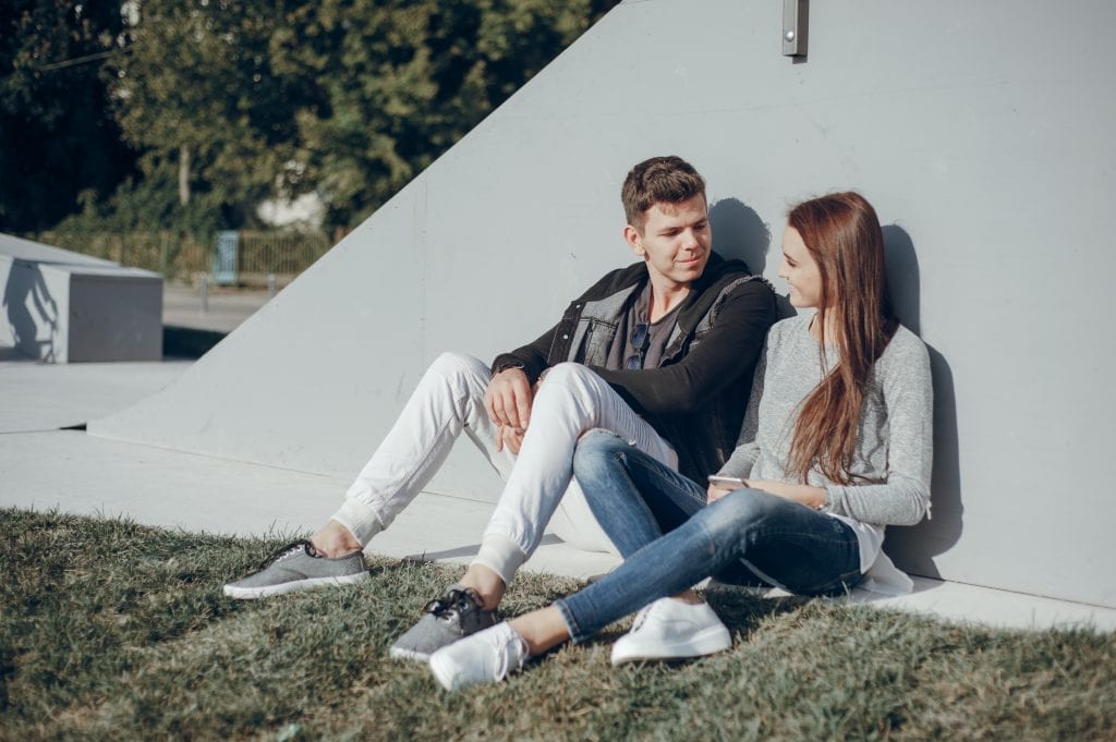 Couple practicing active listening to ease marital friction.