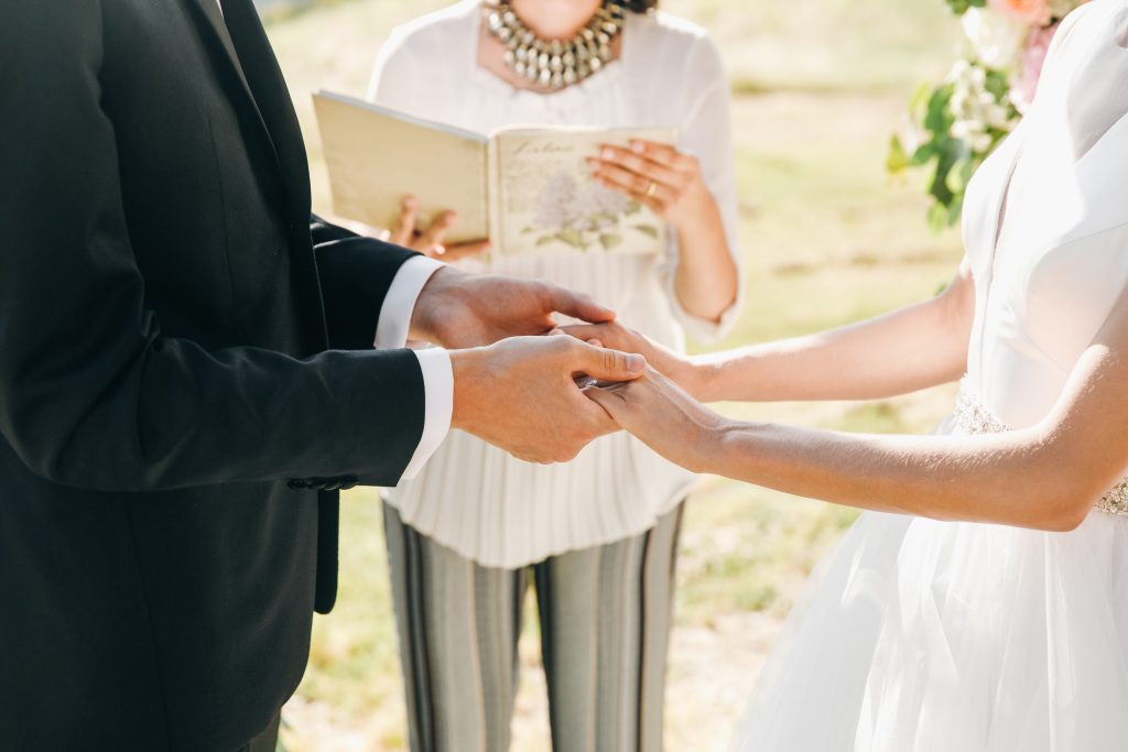 Married couple renewing vows in intimate setting, showing lifelong commitment to growth