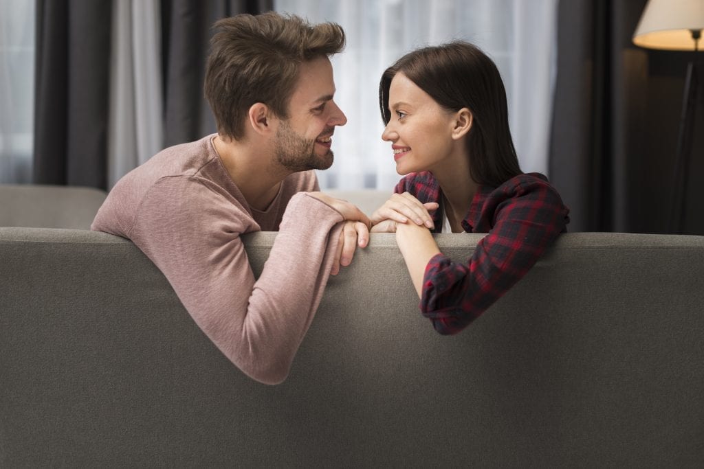 Married couple talking through disappointment, demonstrating emotional honesty and care.