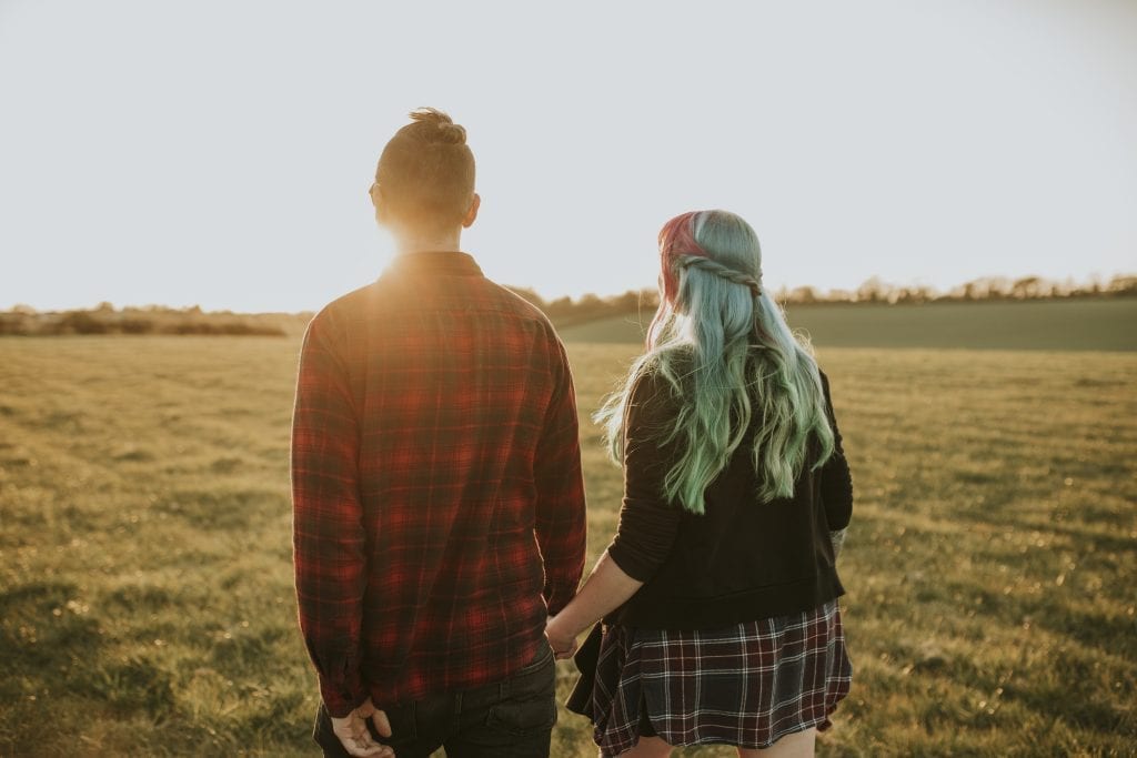 Married couple walking forward through life’s journey together, effort and all
