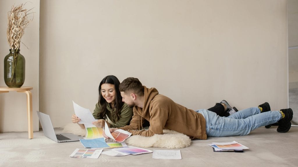 Married couple cooperating on a task in silence, showing perseverance even without strong emotional connection.