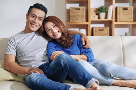 Couple facing sunrise together, symbolizing new beginnings and hopeful commitment