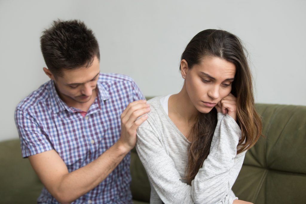 Gentle physical connection between spouses, reflecting emotional leadership and love