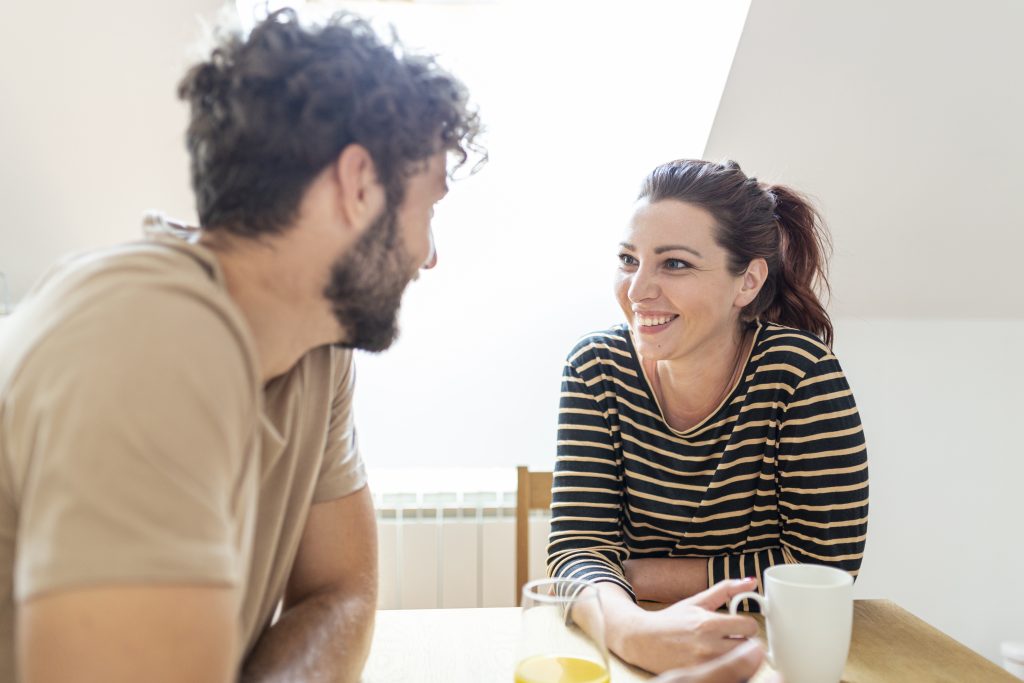 Spouses connecting deeply during a warm, affirming conversation
