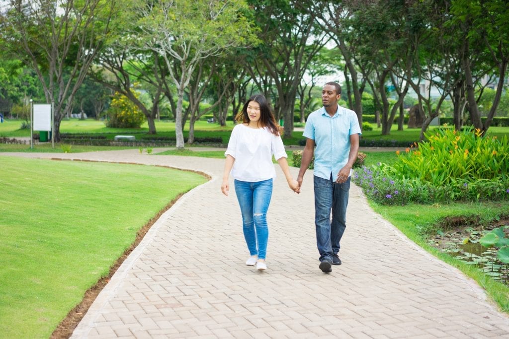 Happy couple enjoying a peaceful walk, symbolizing an easy, flourishing marriage.