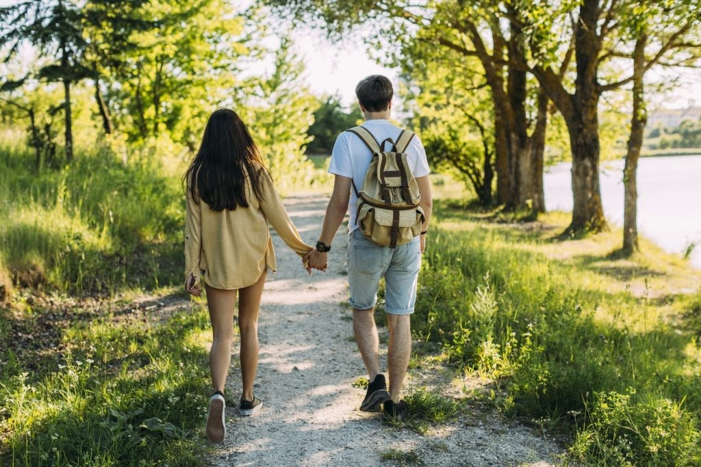 Married couple embracing growth by leaving old patterns behind.