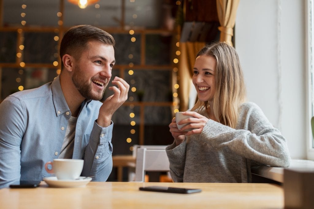 Married couple sharing encouraging words during breakfast.