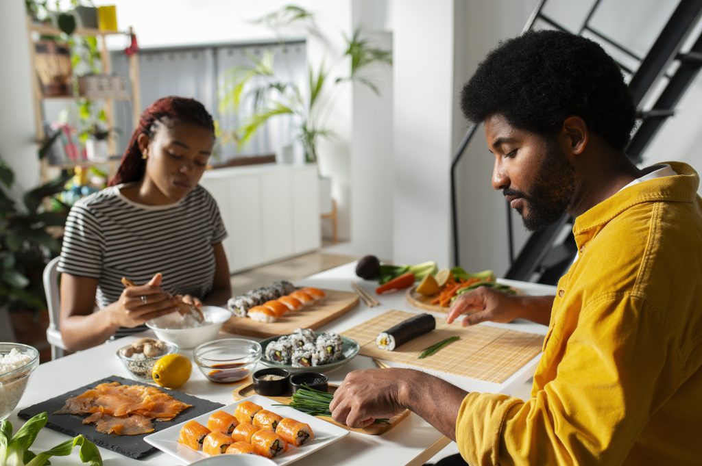 Married couple preparing dinner, showing joy and connection through emotional strength