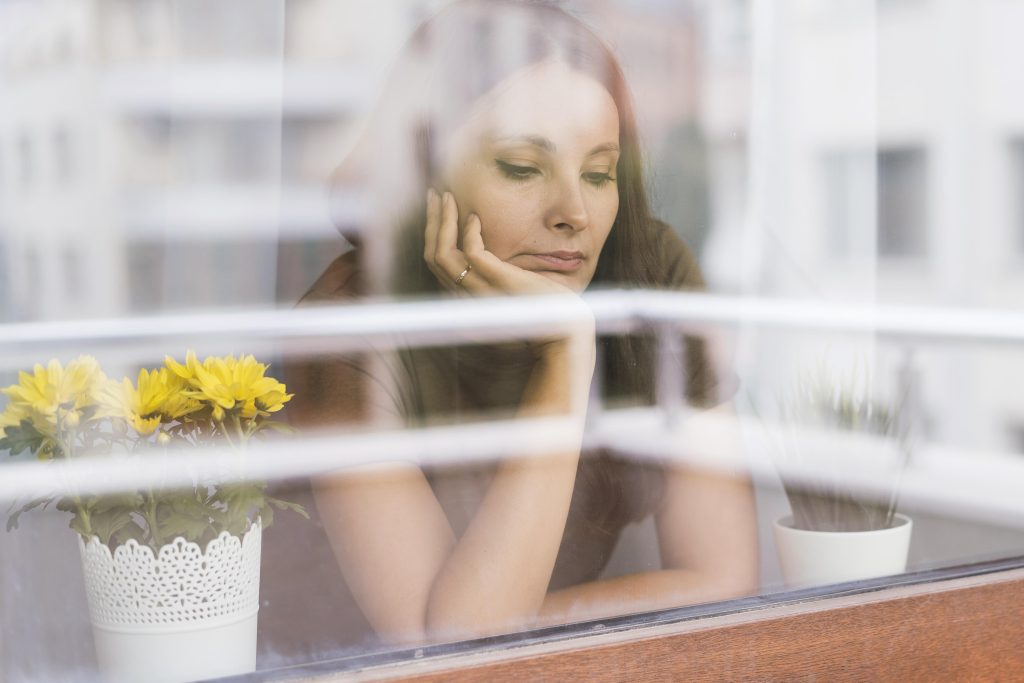 Person pausing to reflect during a moment of emotional clarity in marriage