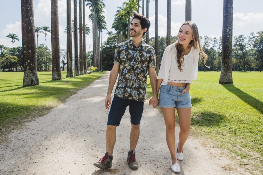 Married couple walking hand in hand, staying connected through simple gestures.