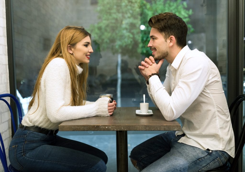 Married couple discussing calmly after an argument, demonstrating healthy disagreement.