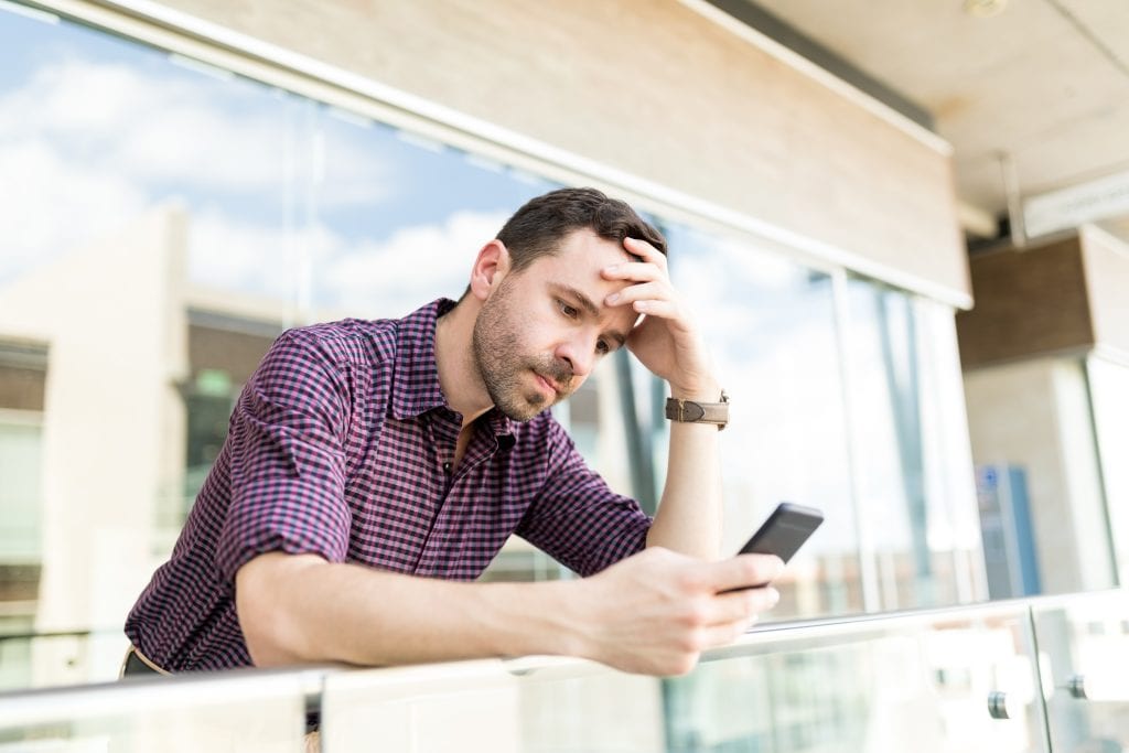 Person feeling torn between peer approval and marriage loyalty, representing social pressure.