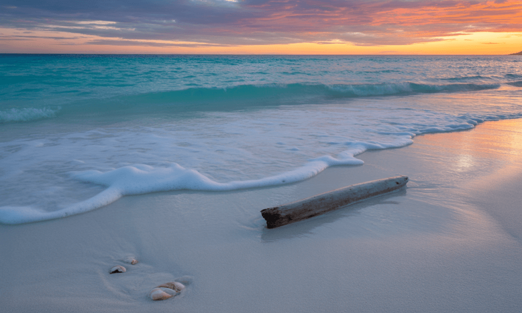 Peaceful ocean waves at sunset, representing calm resolution in marriage.