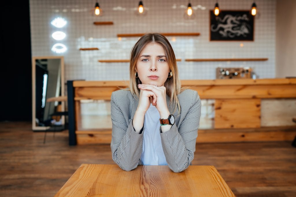 Individual deep in thought, representing unspoken agreement in a relationship.