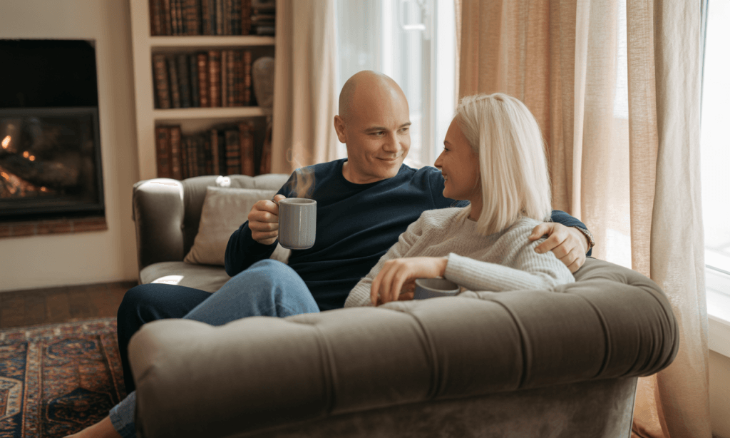 Couple practicing a 10-minute check-in as part of their holiday stress-proof marriage plan.