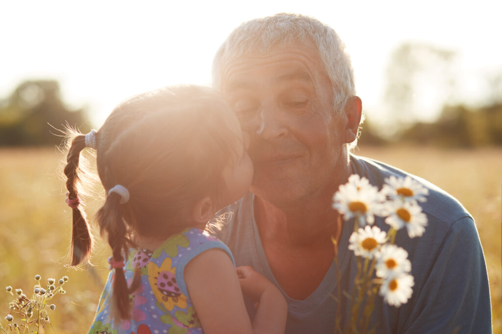 grandparent hugging grandchild warmly to show love behind the guilt