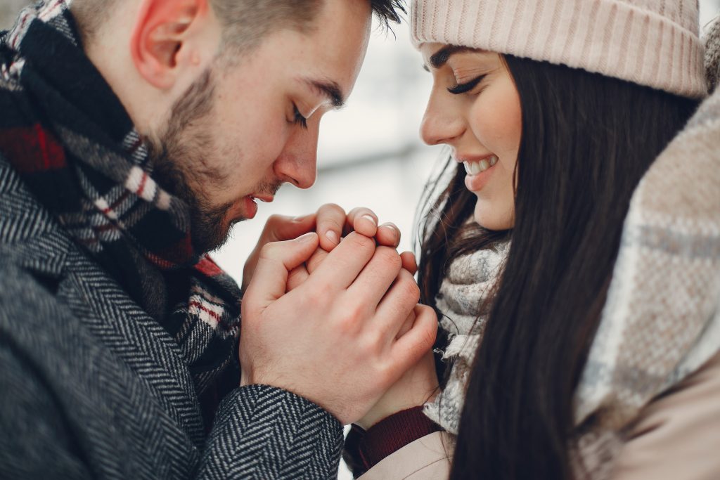 Married couple praying together, expressing gratitude for past blessings as they face current challenges.