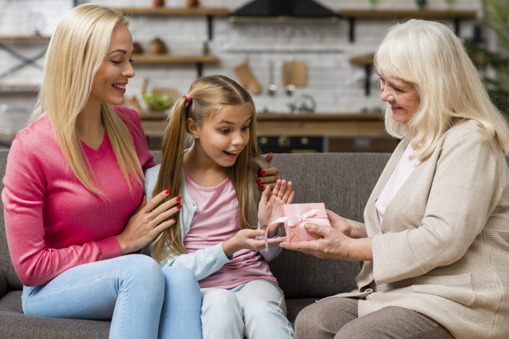 child opening a small family-approved gift with parents and grandparent nearby showing transparency