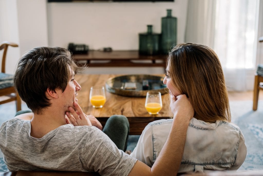 Spouse listening empathetically instead of fixing during a 10-minute check-in.