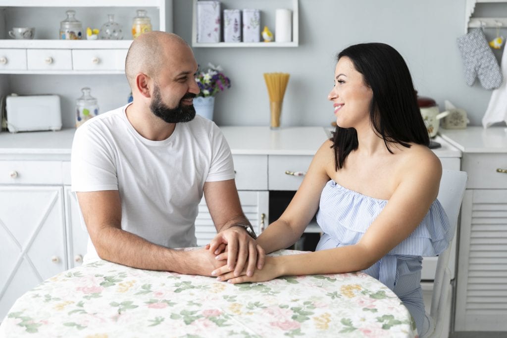 Couple practicing eye contact during their 10-minute marriage check-in.