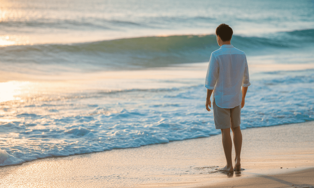 person standing grounded on shoreline representing balance between grace and boundaries