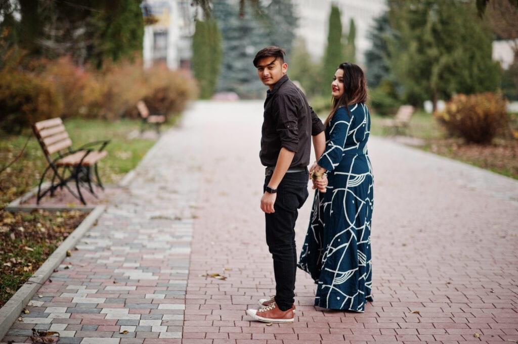 Spouses enjoying a walk device-free, demonstrating shared ritual that sustains gentle boundaries.