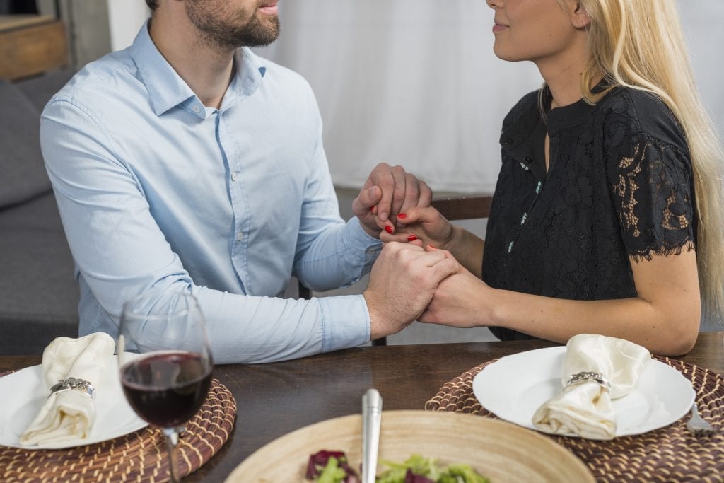 Couple sharing a short daily prayer as a two-minute habit to maintain high spiritual and emotional standards.