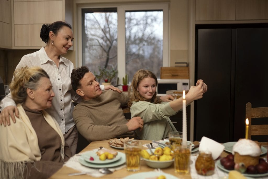 family gathered around dinner table glowing with candlelight symbolizing unity through grace