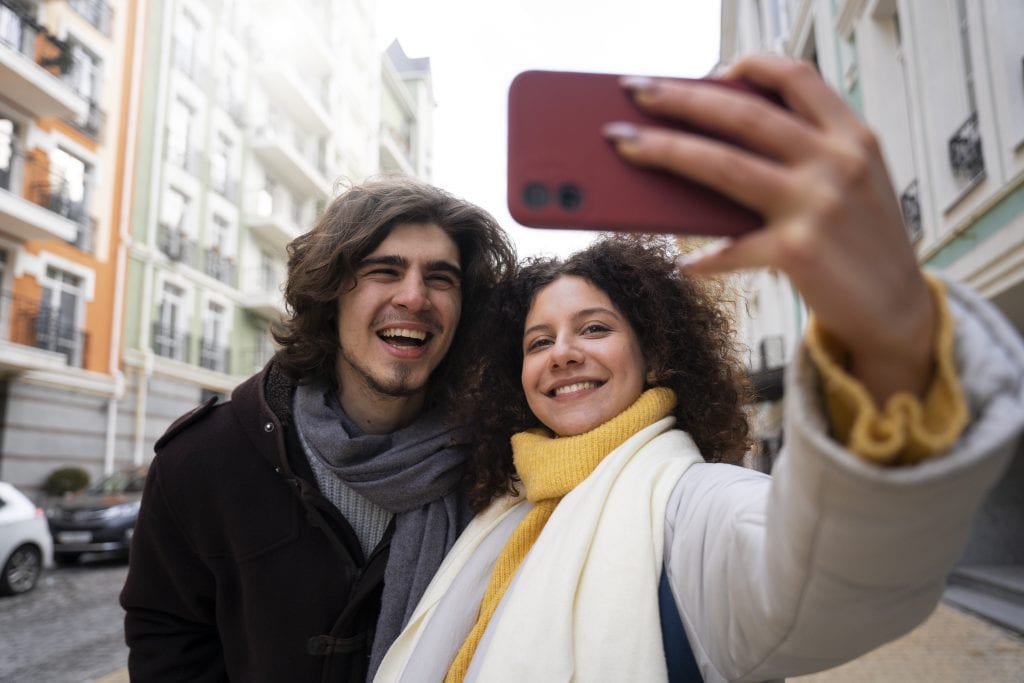 Couple playing tourist in their own town as part of a micro-adventure.