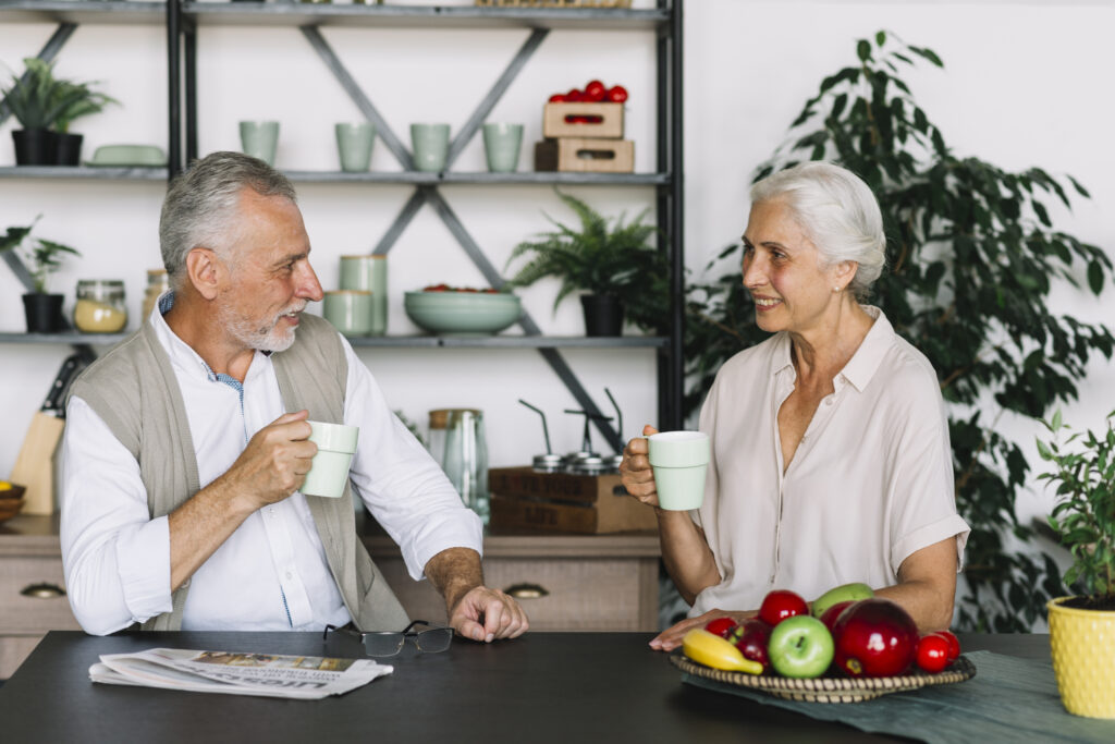 xparents and grandparents having a respectful boundary conversation over coffee in a calm home setting