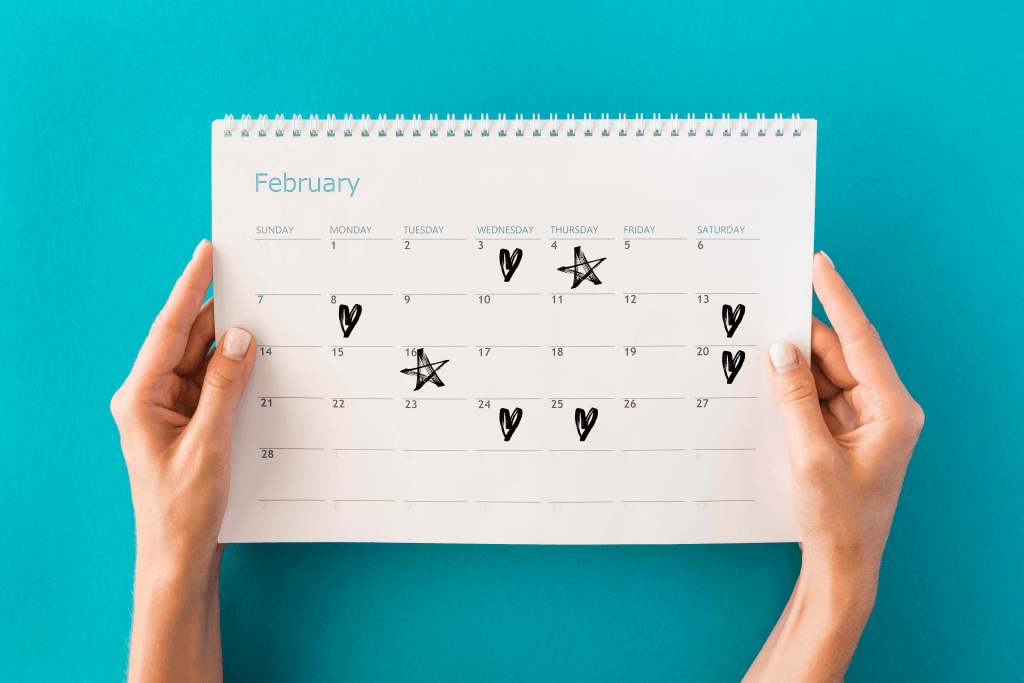 Calendar with daily heart icons showing how tiny habits sustain high marriage standards through repetition.