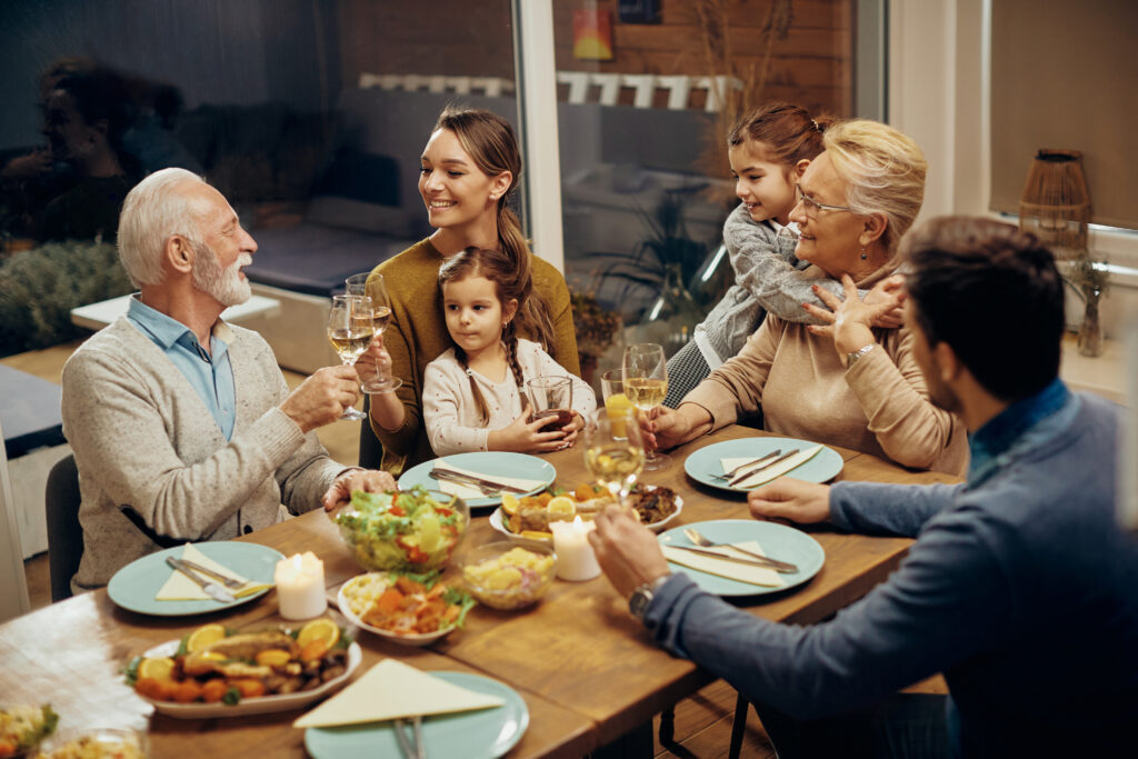 multigenerational family enjoying peaceful dinner representing restored family narrative